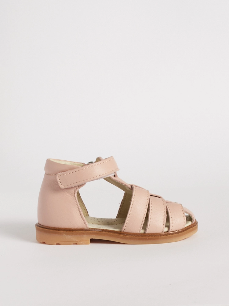 Vista laterale del ragnetto primi passi bambina rosa Marfisa in pelle.