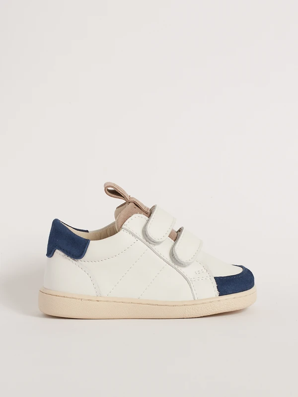 Scarpa primi passi tennis blu bambino modello Paleari in pelle bianca con tallone blu vista laterale